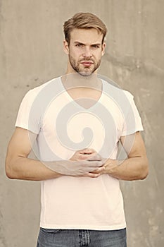 Handsome man unshaven face stylish hairstyle. Handsome caucasian man gray background. Ideal traits that make man