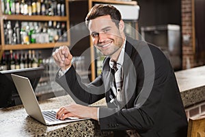 Handsome man using laptop computer