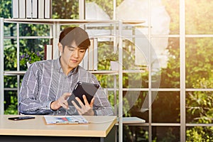 Handsome man using touchpad checking his mail