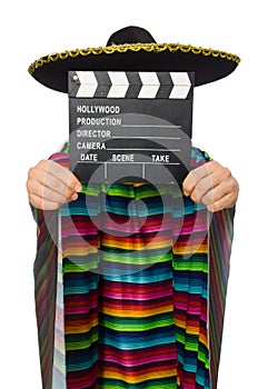 Handsome man in vivid poncho holding clapperboard