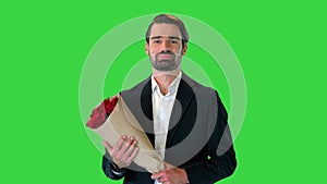 Handsome man walking to the date with bouquet of roses on a Green Screen, Chroma Key.