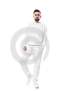 Handsome man wearing blank white clothes on white background