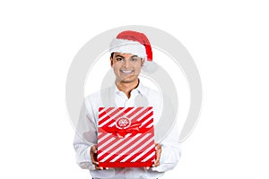 Handsome man wearing Santa hat and holding a present