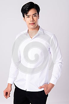 Handsome man wearing a white shirt on white background