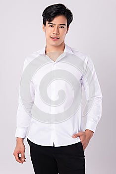 Handsome man wearing a white shirt on white background