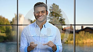 Handsome man working on glass tablet pc.