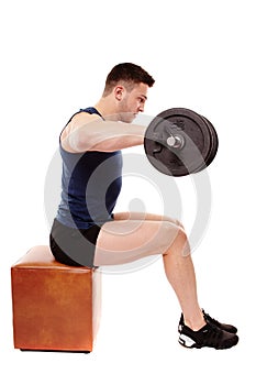 Handsome man working with heavy dumbbells