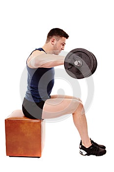 Handsome man working with heavy dumbbells photo