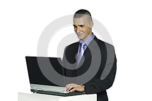 Handsome man working with laptop computer