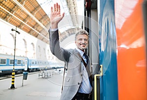 Mature businessman on a train station.