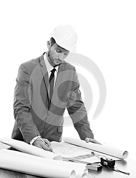 Handsome mature contractor drawing a building plan