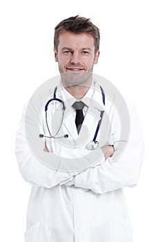 Handsome mature doctor is looking at camera while standing with folded arms