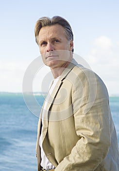 Handsome mature man in beige blazer photo