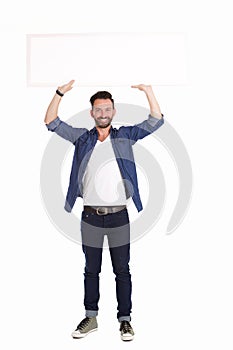 Handsome mature man holding blank billboard over white background