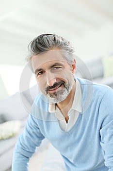 Handsome mature man at home