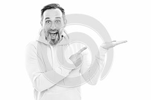 handsome mature man in hoody pointing finger on copy space isolated on white, advertiser.