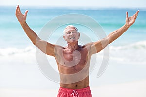 Handsome mature man outstretching his arms