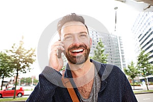 Handsome mature man using mobile phone