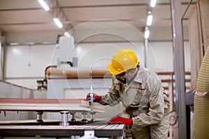 Handsome mature man working in furniture factory