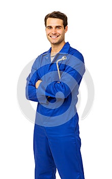 Handsome Mechanic In Overalls Holding Wrench