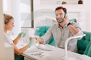 Handsome metrosexual visiting fancy nail salon