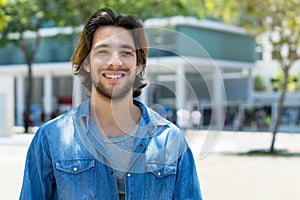 Handsome mexican young adult man with beard