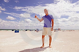 Handsome middle age man at the beach