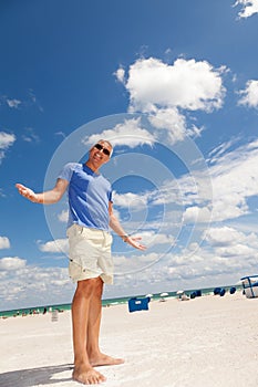 Handsome middle age man at the beach