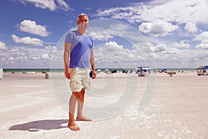 Handsome middle age man at the beach