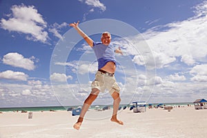 Handsome middle age man at the beach