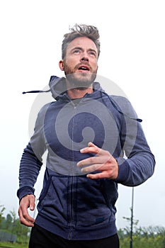 Handsome middle age runner during workout routine