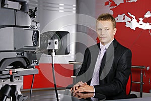 Handsome middle age television news presenter