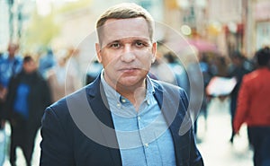 handsome middle aged business man in a blue suit