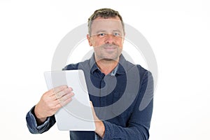 Handsome middle-aged man holding digital tablet in hand