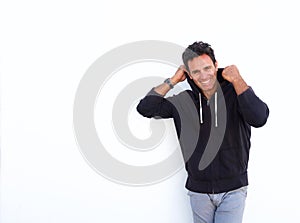 Handsome middle aged man laughing against white background