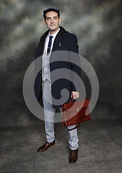 Handsome middle aged man posing in studio on isolated background. Style, elegance, business, gentleman, fashion concept.
