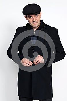 Handsome middle aged man posing in studio on isolated background. Style, elegance, business, gentleman, fashion concept.