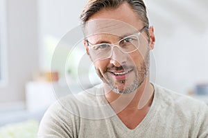 Handsome middle-aged man wearing white eyeglasses photo