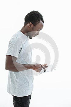 Handsome modern guy with a digital tablet. isolated on white