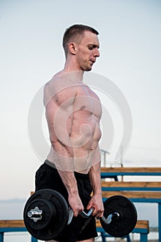 Handsome muscle man near of river