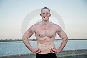 Handsome muscle man near of river