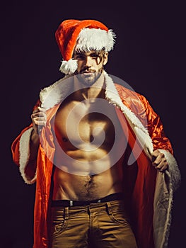 Handsome muscular christmas santa man