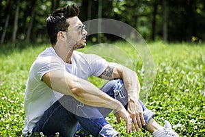 Handsome Muscular Hunk Man Outdoor in City Park