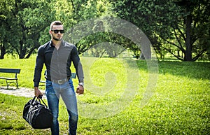 Handsome Muscular Hunk Man Outdoor in City Park