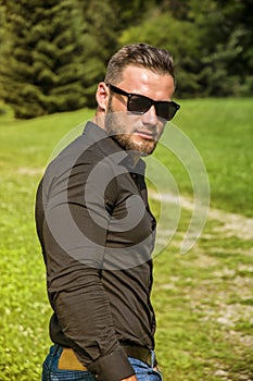 Handsome Muscular Hunk Man Outdoor in City Park