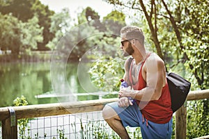 Handsome Muscular Hunk Man Outdoor in City Park