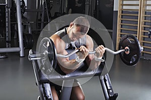 Handsome Muscular Male Model Doing Biceps Exercise