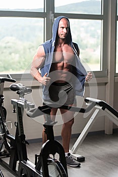 Handsome Muscular Man Flexing Muscles In Gym