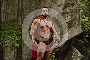 Handsome muscular man in gladiator armor