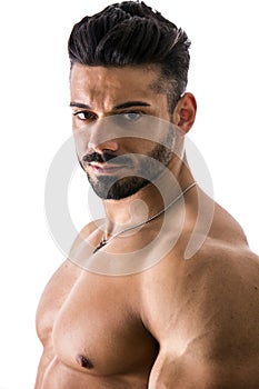 Handsome, muscular man standing isolated